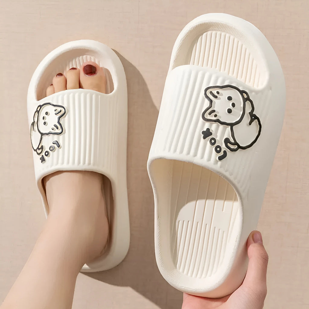 Women's green cat slippers with thick EVA platform sole on a wooden floor