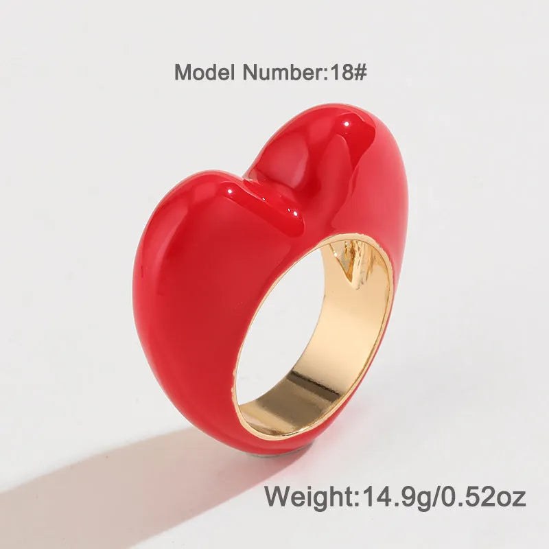 Colourful three-dimensional enamel heart ring on a zinc alloy band.