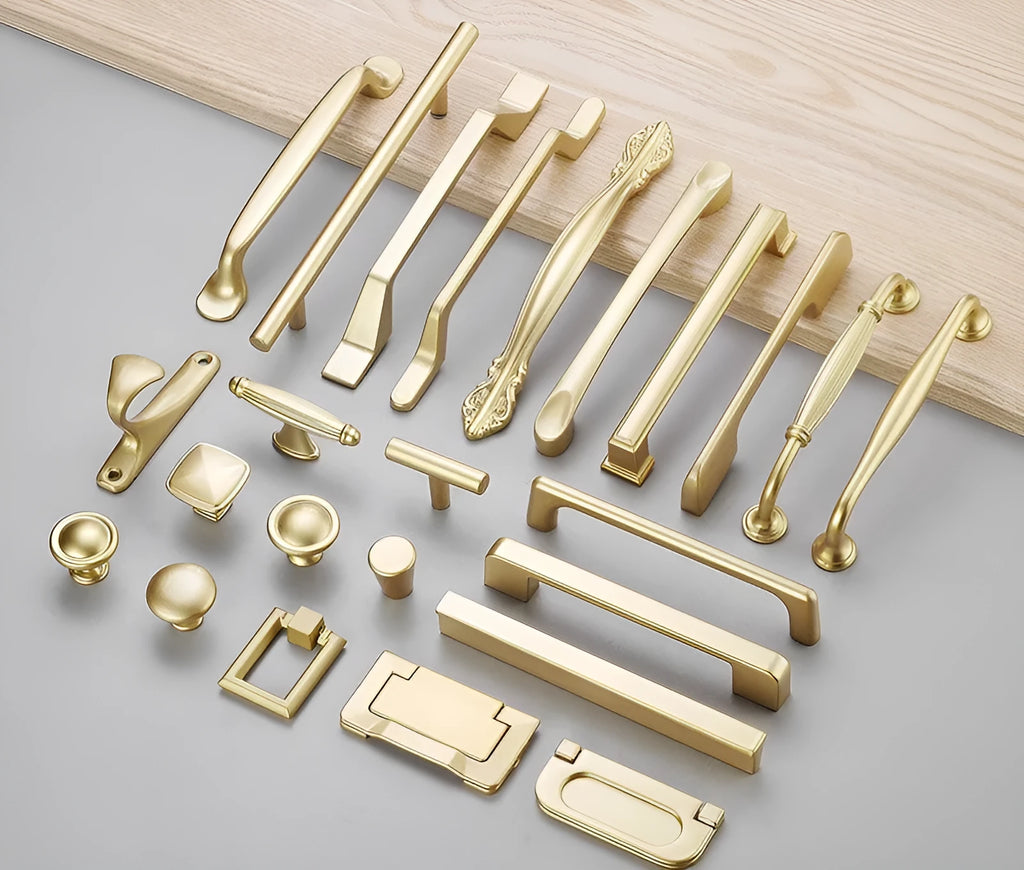 Gold coloured aluminium alloy T-shaped cabinet door handle showing single hole mounting.