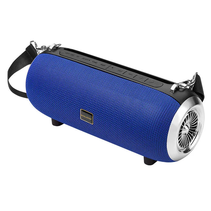 F666 Mini portable Bluetooth speaker with fabric mesh finish, shoulder strap, and standing next to a mobile phone.