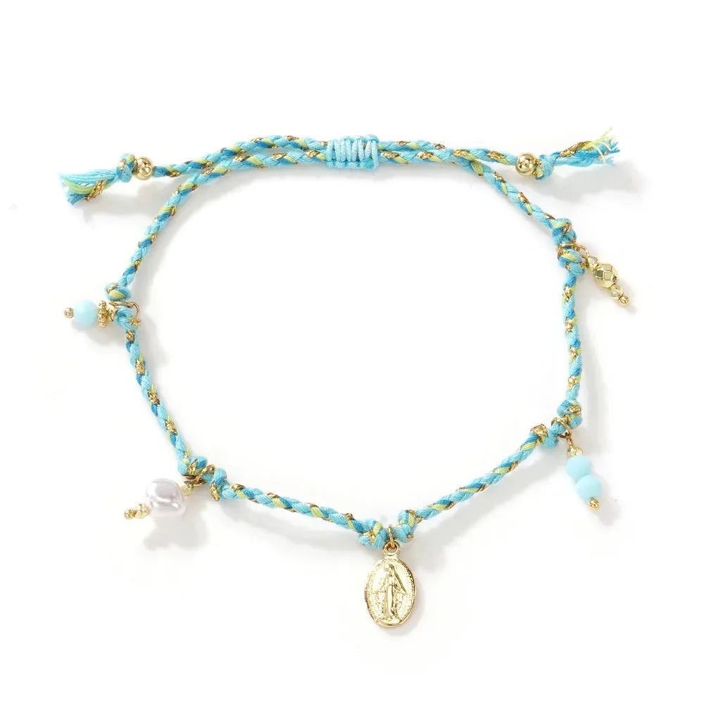 Ethnic style women's bracelet handmade from colourful braided rope with woven carrying strap tag design