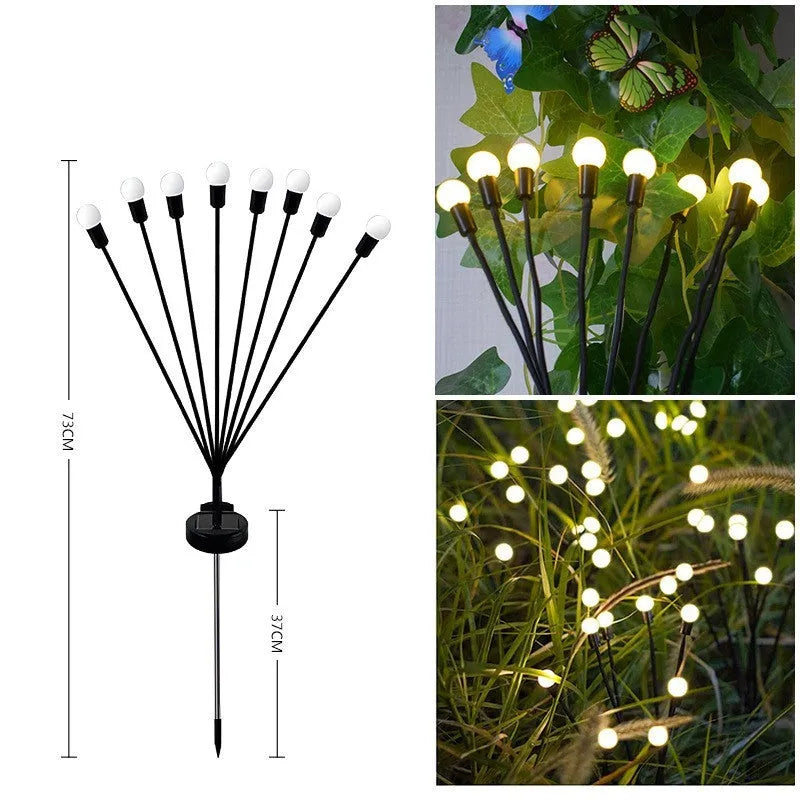 Solar-powered LED garden ground light with multiple heads and a stainless steel stake inserted into soil.