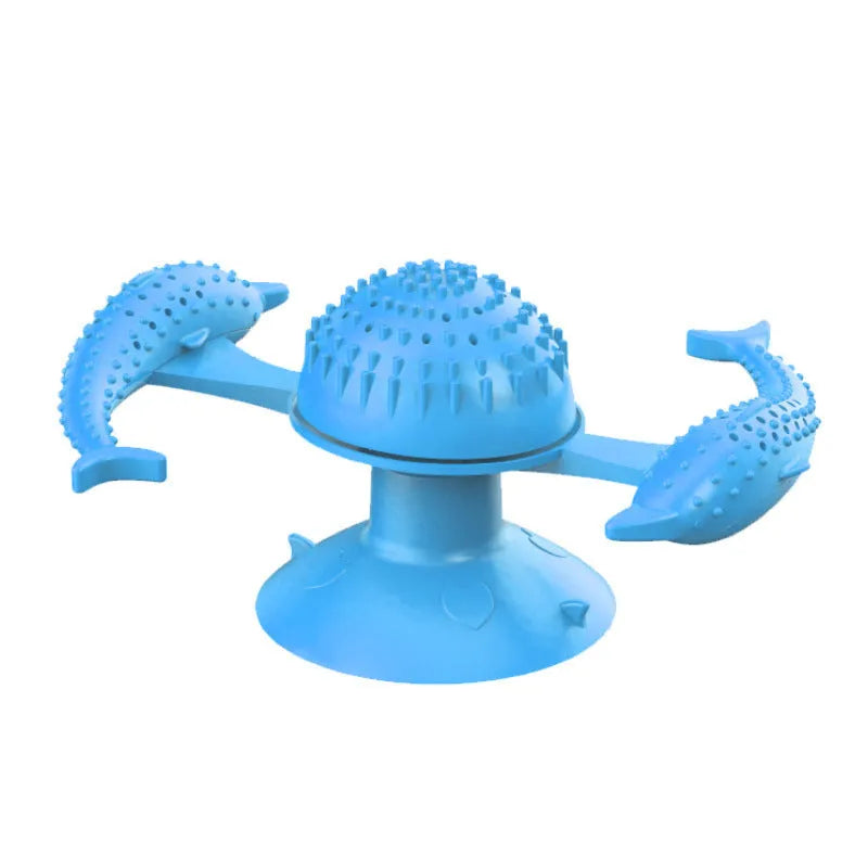 Blue rubber turning windmill cat toy on floor, designed for interactive boredom relief play