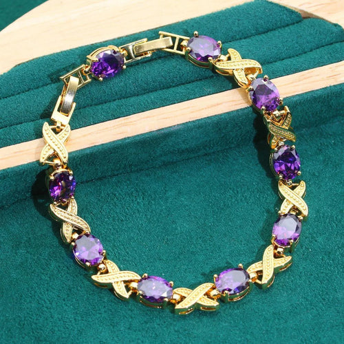 18k gold plated jewellery set with cubic zirconia stones showing necklace, earrings, ring and bracelet