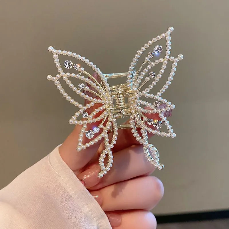 Butterfly hair barrettes in alloy with rhinestone or pearl styles measuring 6.7x6.2cm