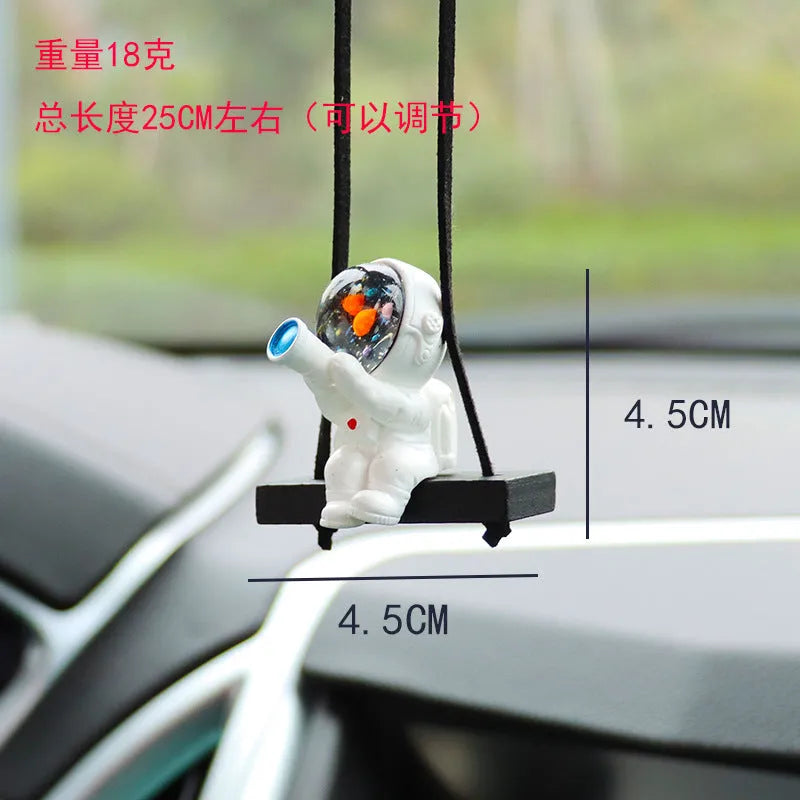 Cartoon astronaut resin pendant for car decoration, shown in various colour and style options.