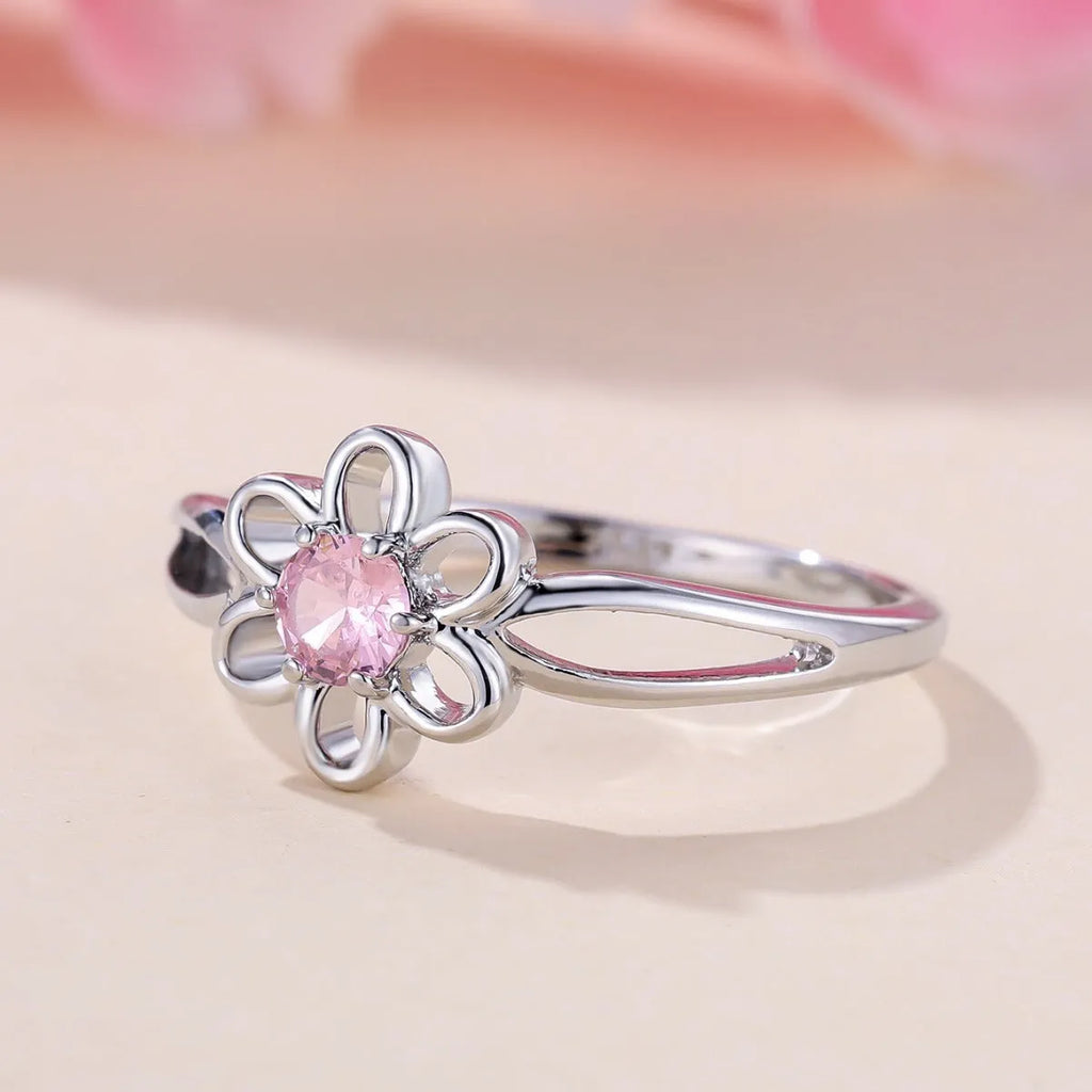 Women's hollow floral ring made from copper with electroplated finish in platinum pink diamond colour