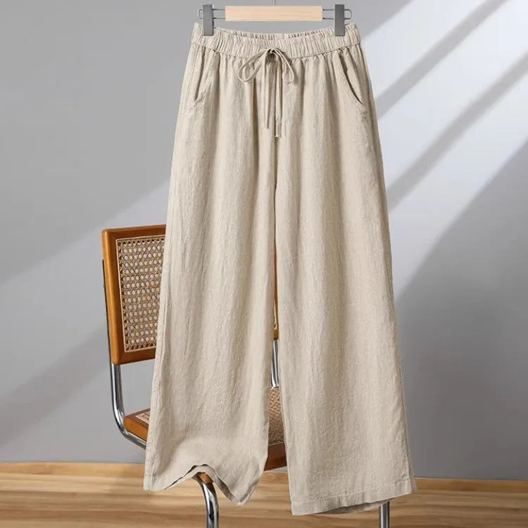 Women's straight leg casual trousers in khaki with an elastic waistband and lace-up drawstring detail.