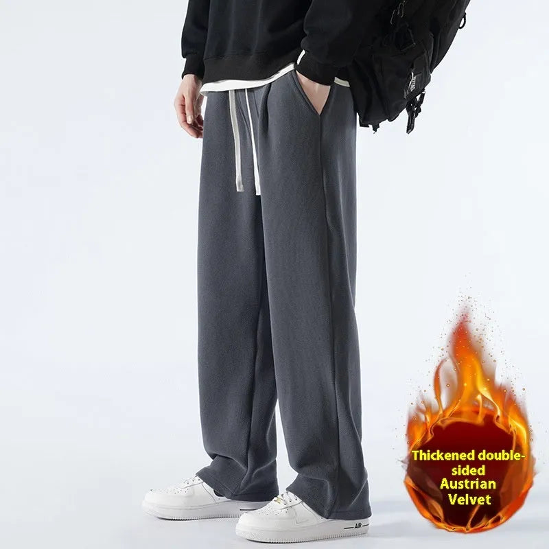 Men's apricot coloured loose-fit polar fleece trousers with a drawstring waistband, shown laid flat.
