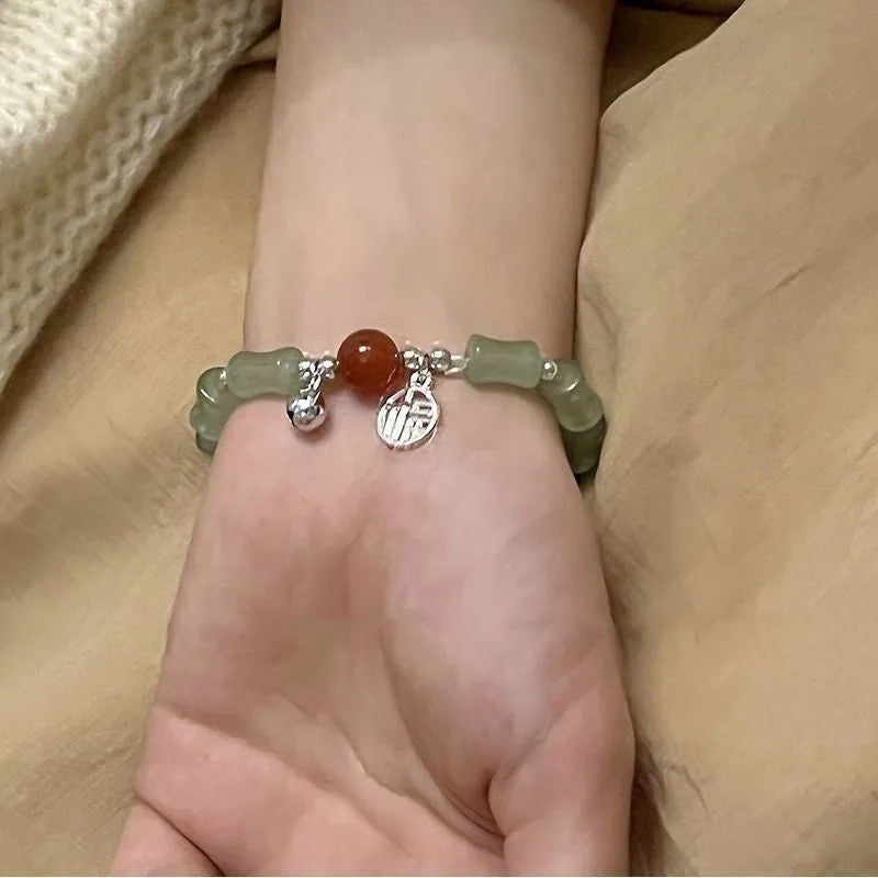Chinese style bamboo leaf glass bracelet for women with a bamboo joint design.