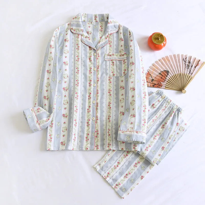 Ladies' long-sleeved cotton gauze homewear set in a striped floral print, showing top and trousers laid flat.