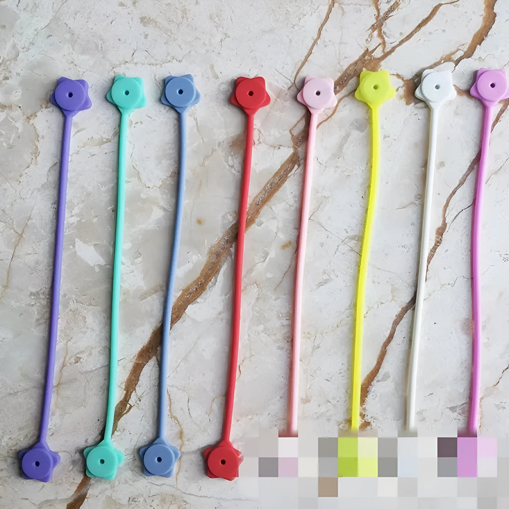 Star-shaped silicone cable winder with magnet for organising mobile phone and headphone wires.