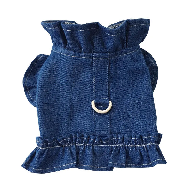 Blue denim dog dress with a ruffled vest design and a metal leash hook on the chest.