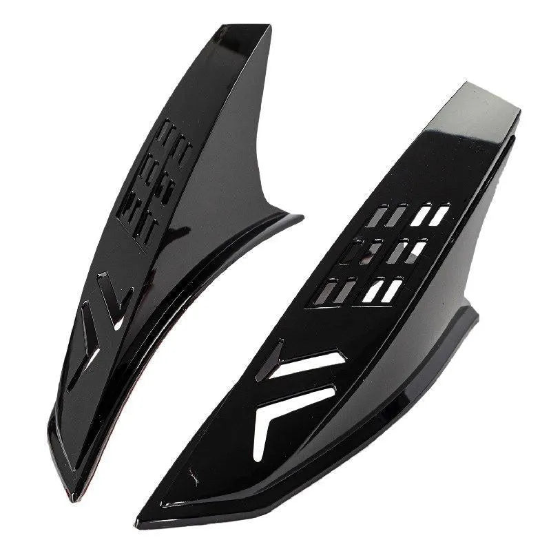 A pair of coloured helmet horns for child's motorcycle or ski helmet modification.
