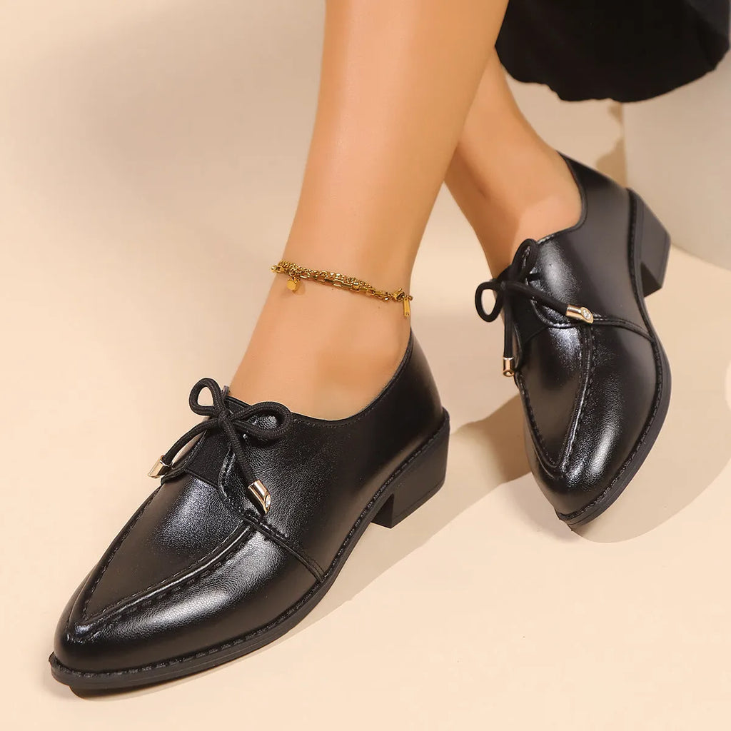 Women's British-style leather shoes with bow detail showing PU upper and rubber sole construction