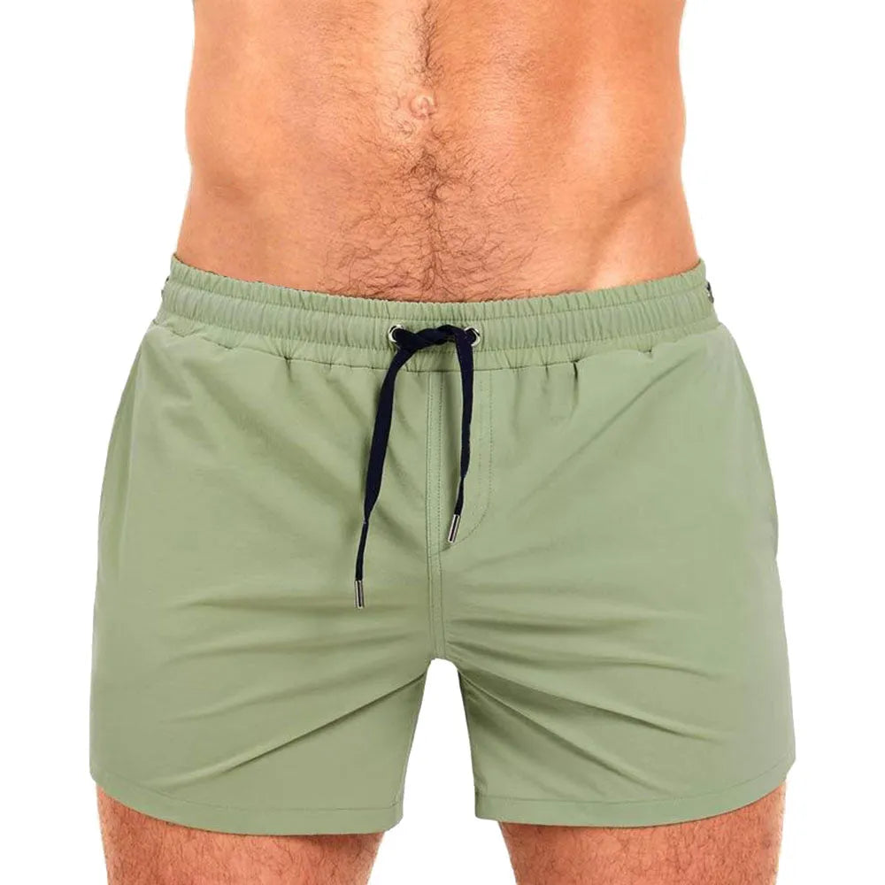 Man's mesh lining sports shorts in army green colour for swimming and fitness