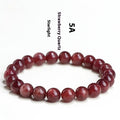 Natural starlight cherry red strawberry quartz bracelet with geometric beads on wrist