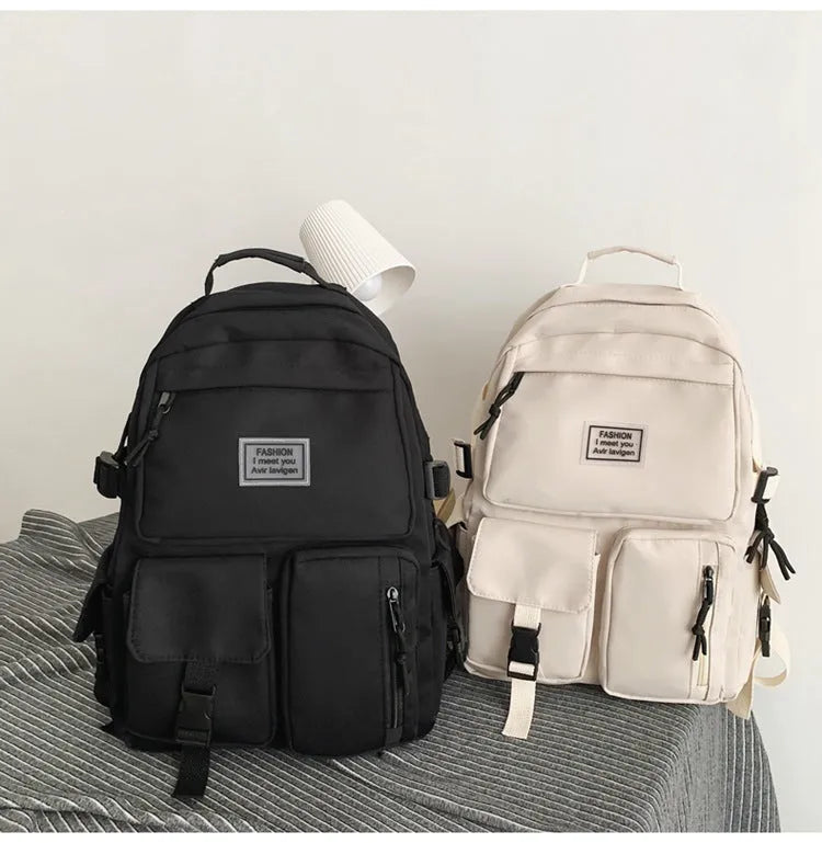 Black nylon student backpack with laptop compartment and front pocket