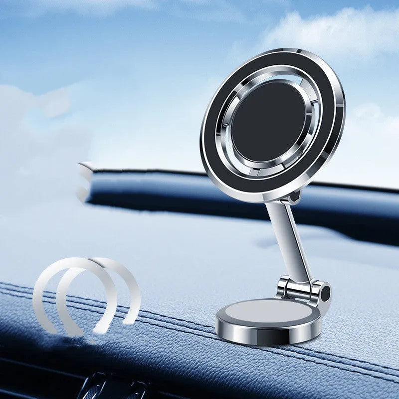 Black car phone holder with magnetic clip mount attached to a vehicle instrument panel