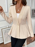 Women's apricot coloured Jacquard patterned knitted cardigan with one button, shown on a model.