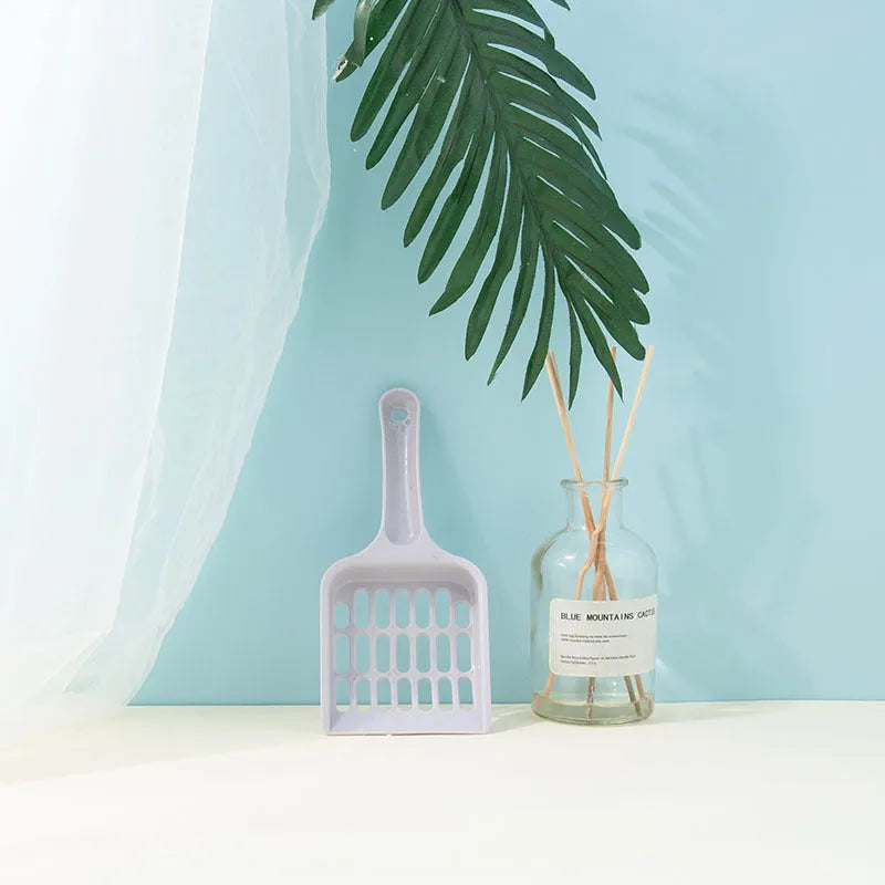 Plastic cat litter shovel in pink, 19.5x8x2.5cm, for small cleaning tasks