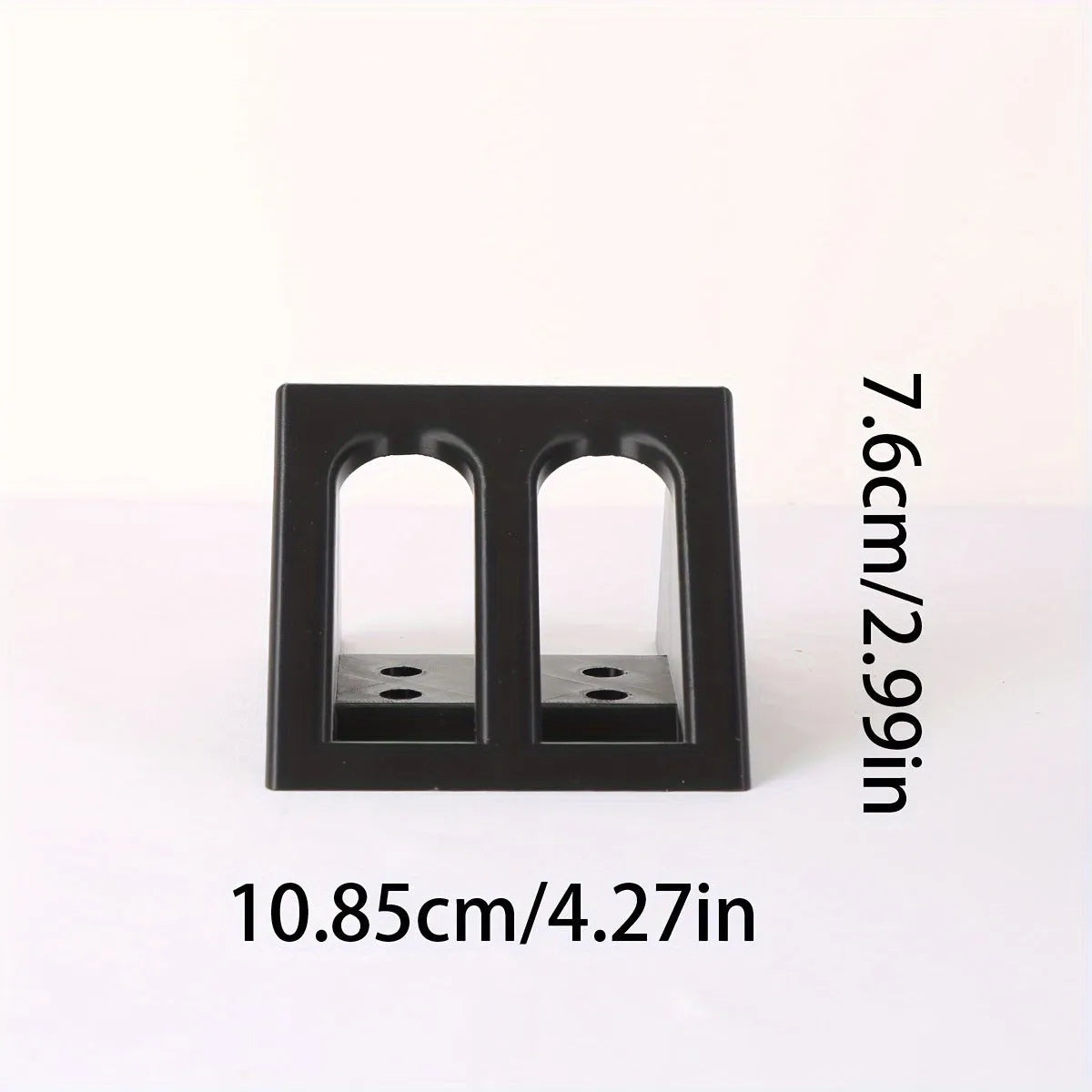 Black plastic pistol stand with punk-style design for displaying firearms