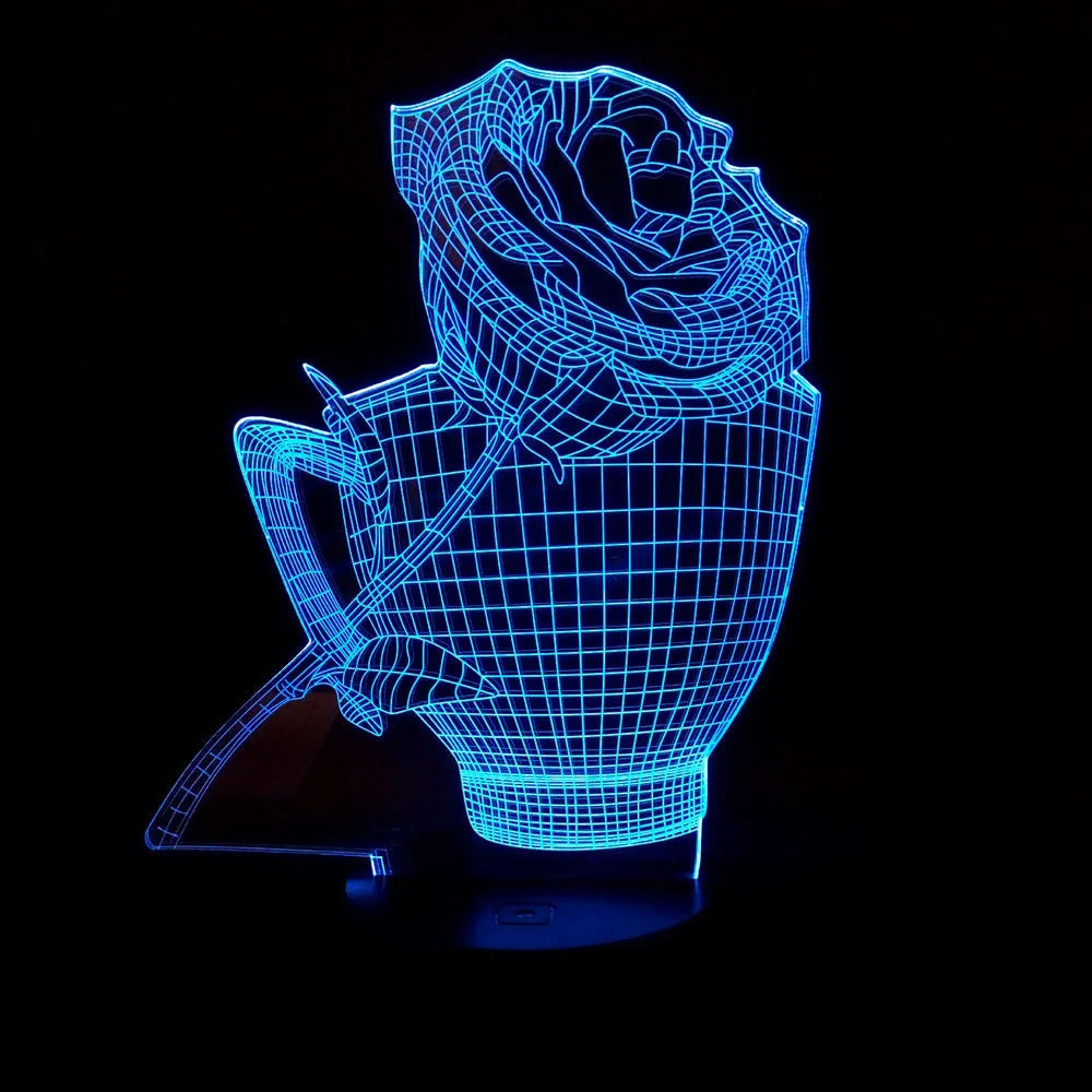 3D rose flower shaped night light with remote control on a table.