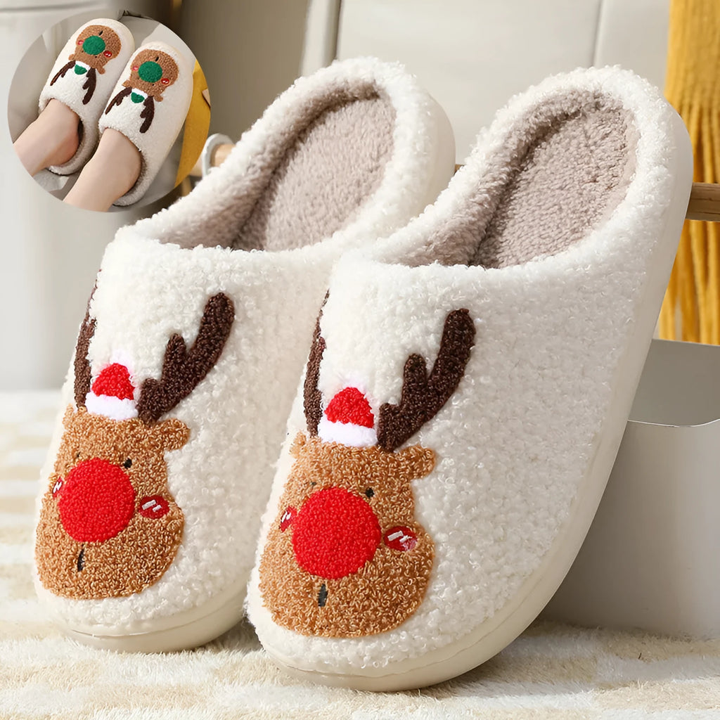 Pair of red Christmas elk plush home slippers on floor, soft anti-slip shoe design