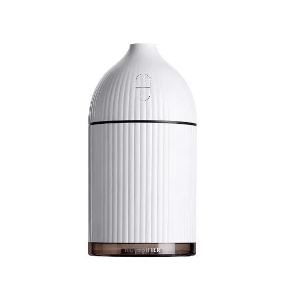 White ultrasonic aromatherapy diffuser and humidifier with 300ml capacity, USB port, and LED light on a wooden surface.
