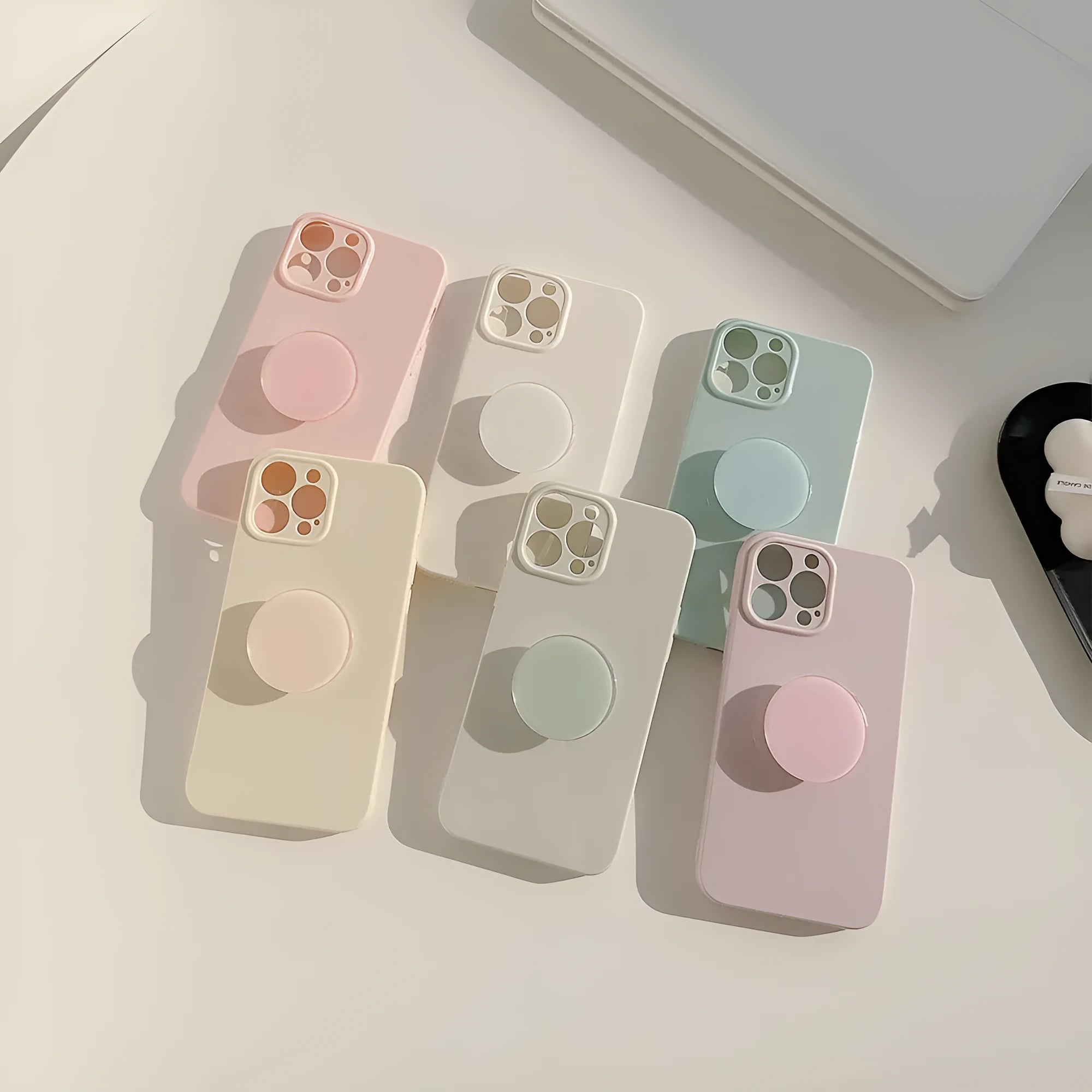 Solid colour TPU bracket phone case for iPhone with detachable kickstand, showing a back view with bracket attached
