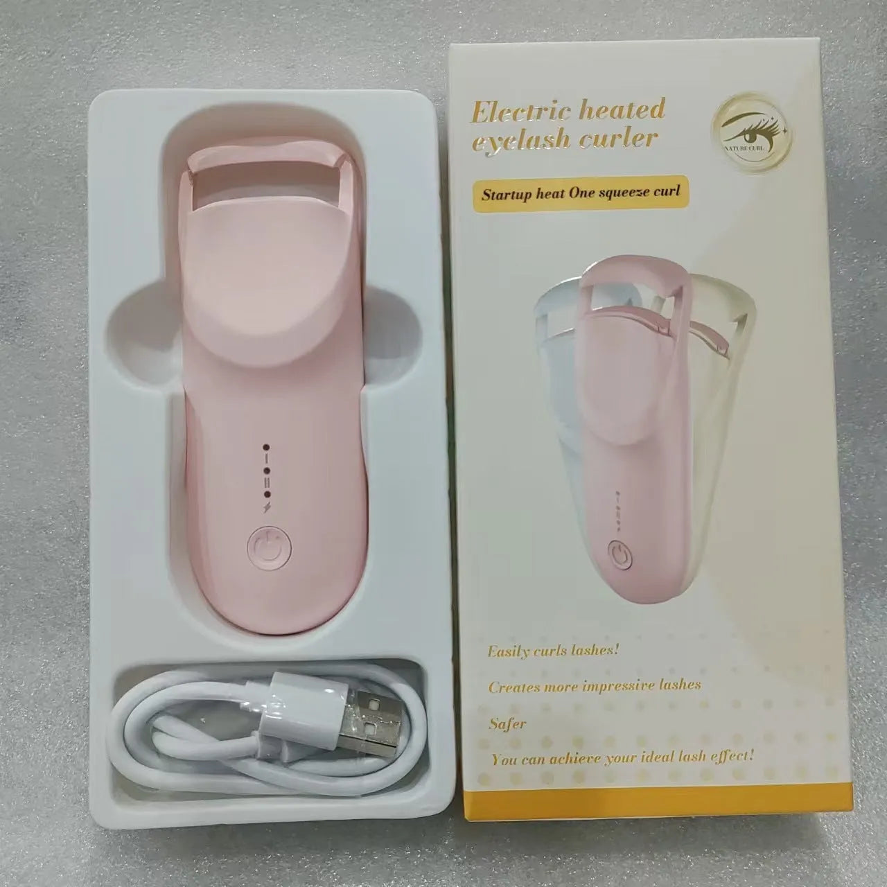 Electric eyelash curler with USB charging cable in cream white, maca pink or vanilla apricot colour options