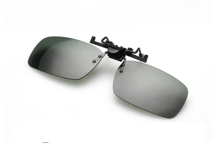 A clip-on sunglasses accessory with PC lenses shown in dark green, grey, and night vision tints, designed to fit over prescription glasses.