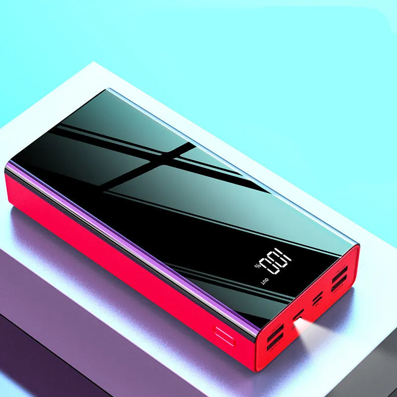 Large black or red 40000mAh power bank with LCD digital display showing battery level.