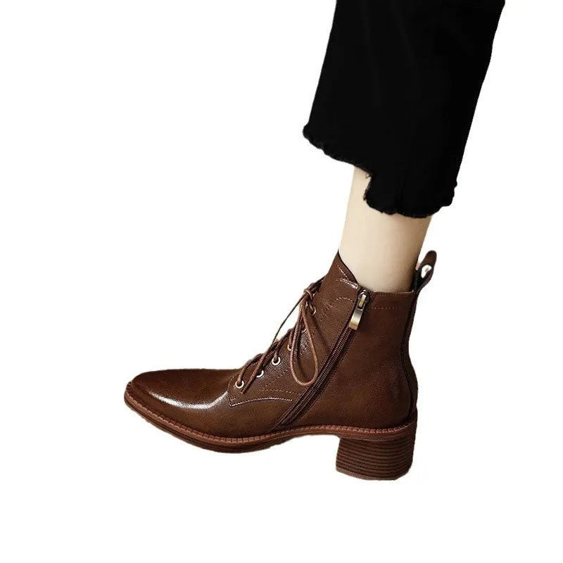 Women's black pointed-toe short tube boots with 5.5cm heel and velvet detailing on artificial PU upper