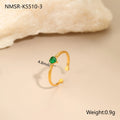 Open-ended stainless steel ring with a geometric heart shape inlaid with green zirconium on a plain background.