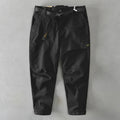 Men's cotton overalls with elastic waistband in army green colour showing loose trousers design