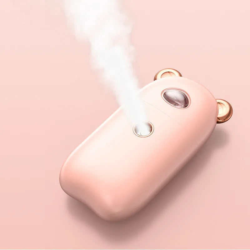 USB rechargeable portable hand humidifier and face steamer in white with cold spray mist