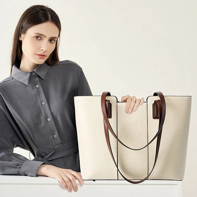Black genuine leather women's shoulder bag showing multiple internal compartments and single strap