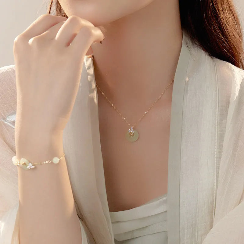 925 silver orchid flower pendant necklace with a peace buckle on an O-ring chain.