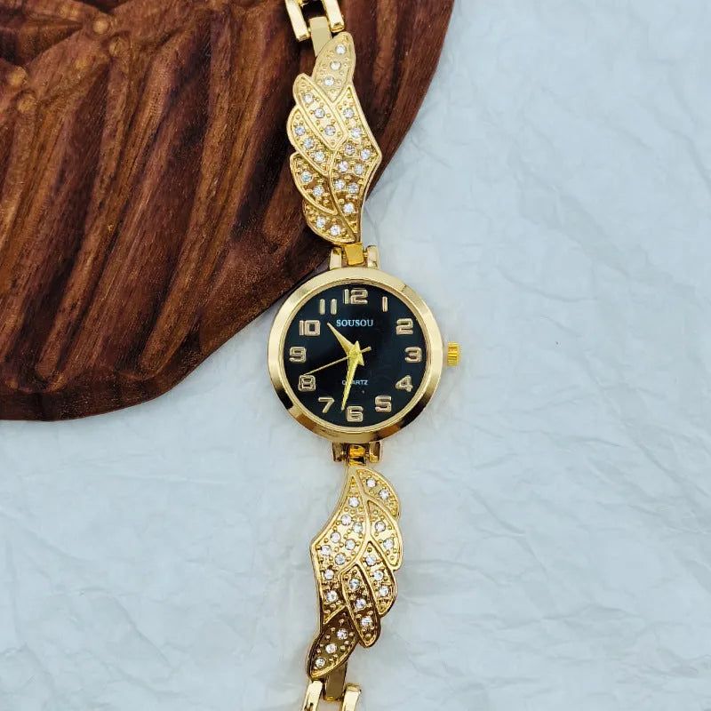 Women's stainless steel watch with round dial showing gold face colour option