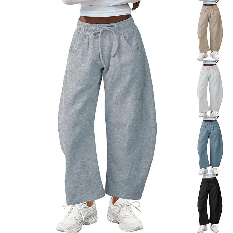 Loose cropped sweatpants with elastic drawstring waist in cotton fabric, shown in multiple colour options