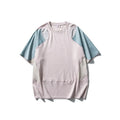 Men's loose blue patchwork t-shirt with raglan short sleeves on a mannequin.