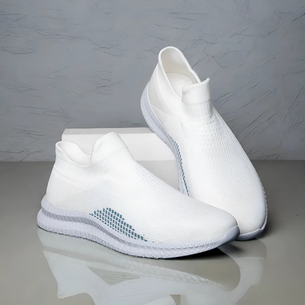 Popcorn Flyknit fabric low-top casual sneaker in white, black, or blue with a flat heel.