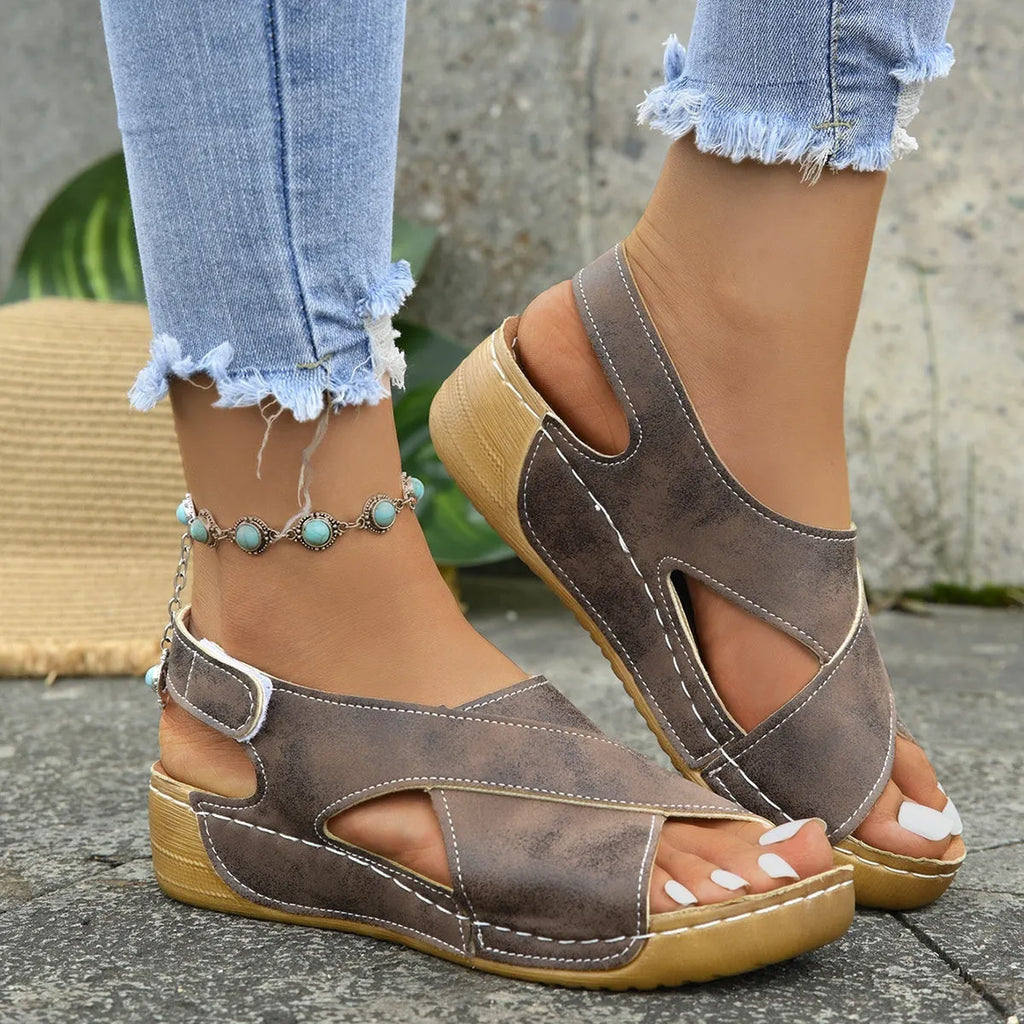 Roman platform sandals with a skirt detail and open toe design on a rubber sole