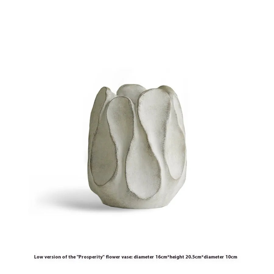 Irregular art ceramic vase in magnesium clay material displayed in high and low style options