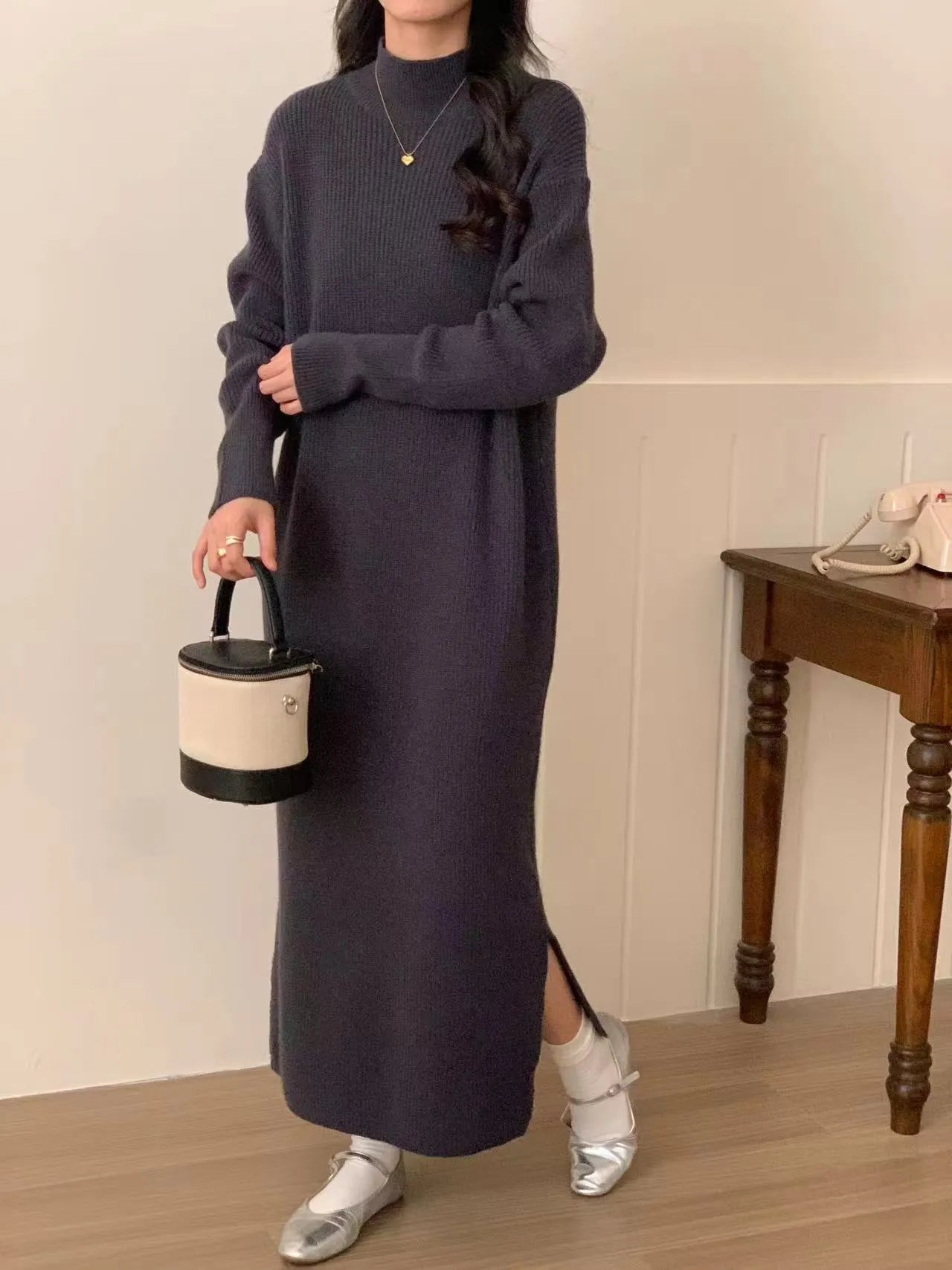 Acrylic knit high waist mid-length dress in solid colour with long sleeves.