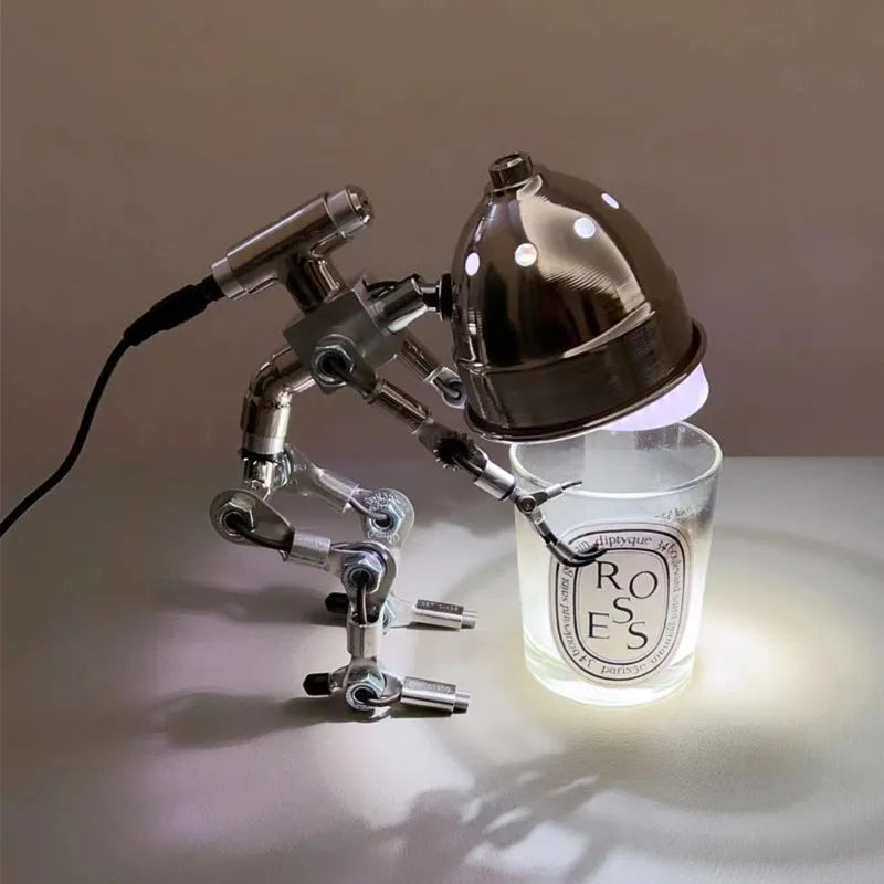 Silver and copper robot-shaped decorative desk lamp in 22cm and 29cm sizes.