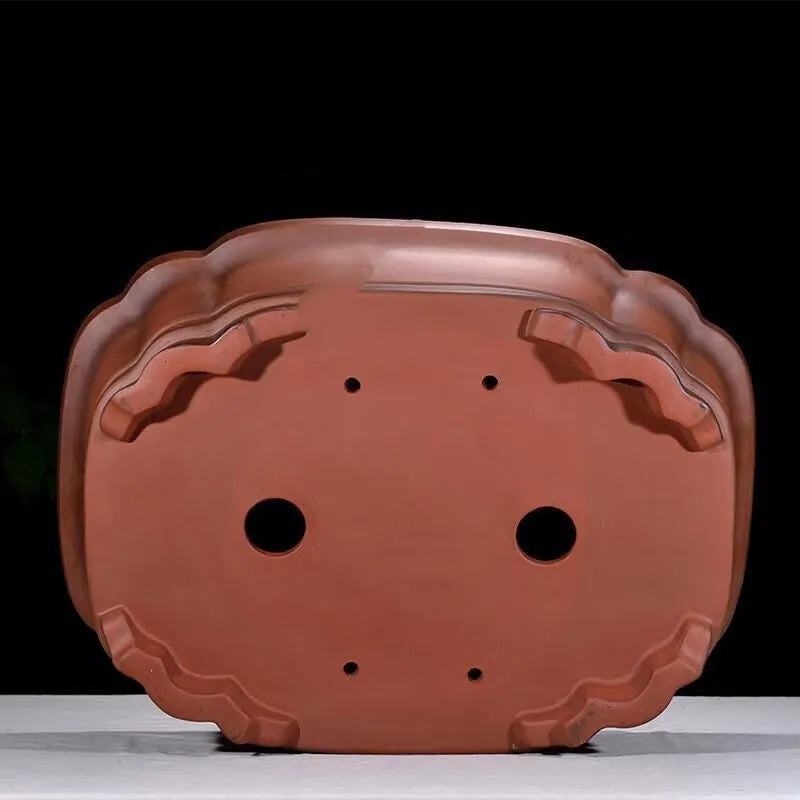 Large antique-finish Chinese purple clay flower pot with detailed tree stump and floral motif sculpture.