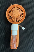 USB rechargeable plastic personal fan in apricot colour on a white background.