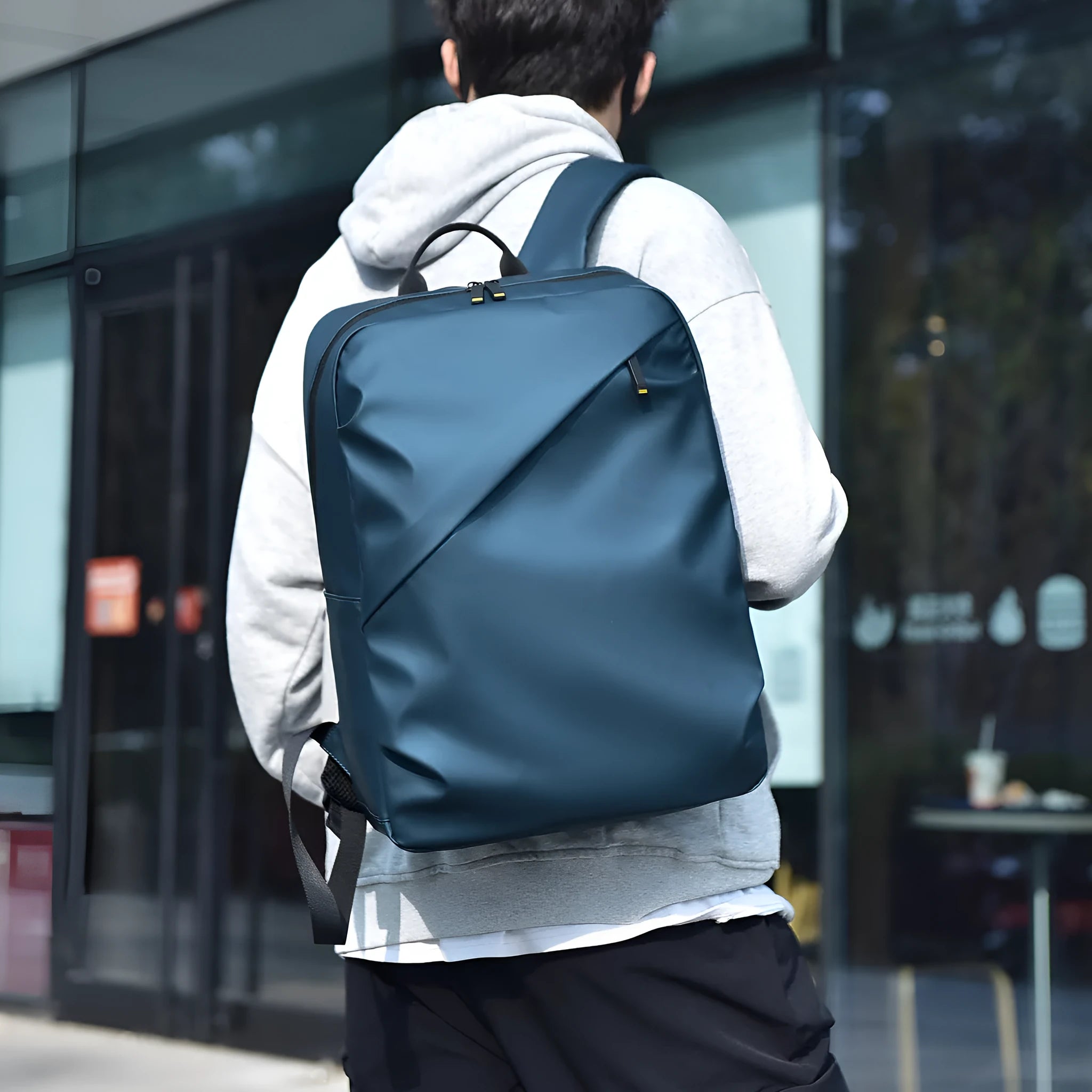 Large black waterproof backpack with 40 litre capacity and PU leather construction